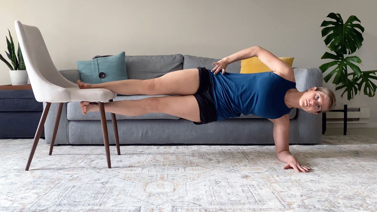 a photo of a woman doing a copenhagen plank