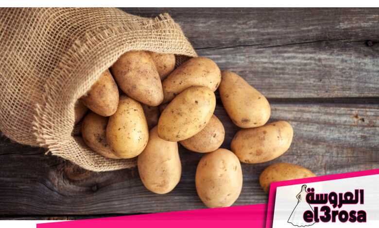 A bag of potatoes on a wooden surface